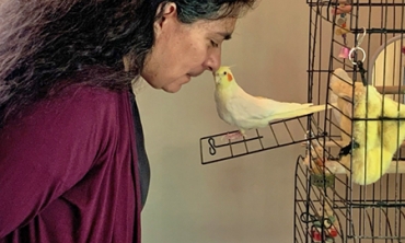 Rebecca (Becky) Cortez, professor of mechanical engineering and director of Engineering at Union, whistles with Maddie, her daughter's cockatiel.