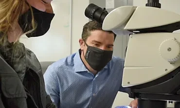 Scott Kirkton, associate professor of biology, with a student