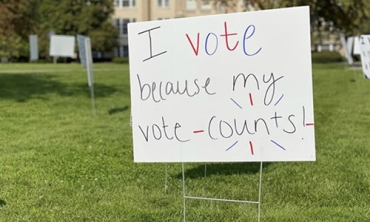 A campus sign encouraging students to vote