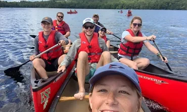 Union College students canoeing Rich Lake in the Adirondack mountains