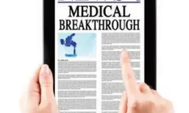 Hands surfing medical news on a tablet