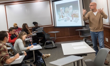 Professor Kenneth Aslakson teaching an American Studies clas.