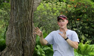 College arborist Joe Conti talks about a ginkgo tree in Jackson's Garden.