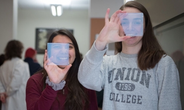 Annelise Lobo '22 and Joana Santos '20 (right) peer through aerogel.