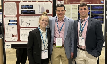 Grace Heiting ’22 and Andrew Sheahan ’22 with Scott Kirkton