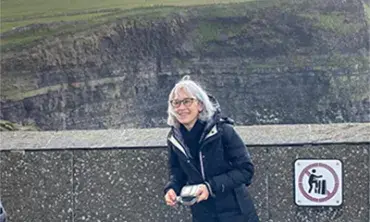 Joyce Madancy, professor of history, at the Cliffs of Moher