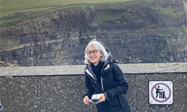 Joyce Madancy, professor of history, at the Cliffs of Moher