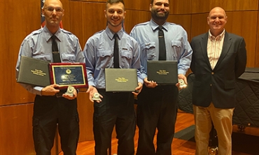 At their recent graduation from the Zone 5 Regional Law Enforcement Training Center program, from left, Officers Peter Parker, Corey Compositor and Adam Blanc are joined by Scott Jones, vice president for administration and finance. Officer Parker graduated as class leader.