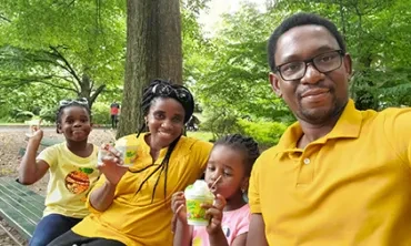 On a visit last summer to Central Park in New York City, Michael Okwori with, from left, daughter, Grace; wife, Kate; and daughter, Marvella