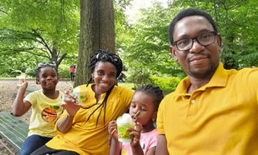 On a visit last summer to Central Park in New York City, Michael Okwori with, from left, daughter, Grace; wife, Kate; and daughter, Marvella