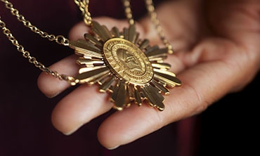 Presidential Medallion which has the College’s seal engraved on the front