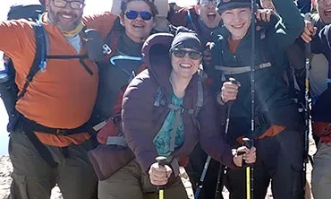 Sara Garrand '97, MAT '00 (with yellow poles) and other members of Troop 4054, atop&nbsp;Baldy Mountain (12, 441 ft.) in New Mexico's Cimarron Range.