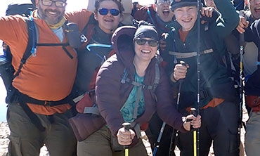 Sara Garrand '97, MAT '00 (with yellow poles) and other members of Troop 4054, atop Baldy Mountain (12, 441 ft.) in New Mexico's Cimarron Range.