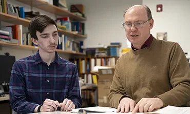 A student and astronomy professor consider some documents