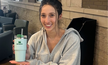 Lucy Mastrianni '24, with a smaller version of the Stanley cup that is the latest collectible craze sweeping the nation.