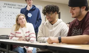 Students in a civil engineering class engaged in thoughtful conversation