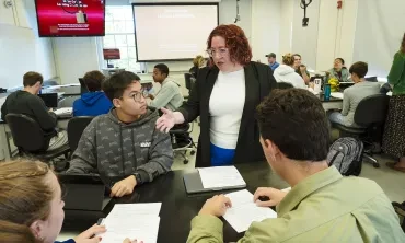 Associate Professor of English Jennifer Mitchell '04 in a classroom with students