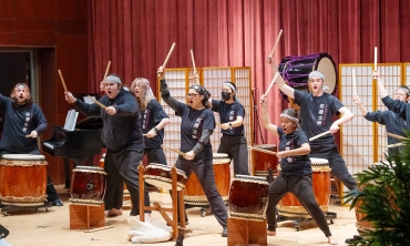 Students performing in a Japanese druming exhibition