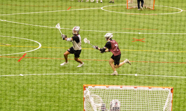 Students playing on the turf field