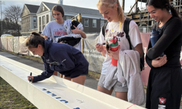 Students sign the final ECSI beam 