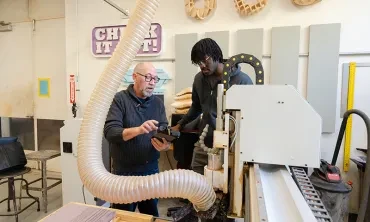 On a recent weekday afternoon, Cole Belmont, Union’s Makerspace director, stood beside a CNC router (computer numerical control) in a lab in the Feigenbaum Center for Visual Arts. Enoch Fashola ’30, a mechanical engineering major from Houston, listened intently as Belmont explained how they were going to use the automated, computer-driven cutting and milling machine to create three-dimensional tiles for display in the lab. “We can make complex, precise cuts with this,” Belmont said. “It opens up a whole ran