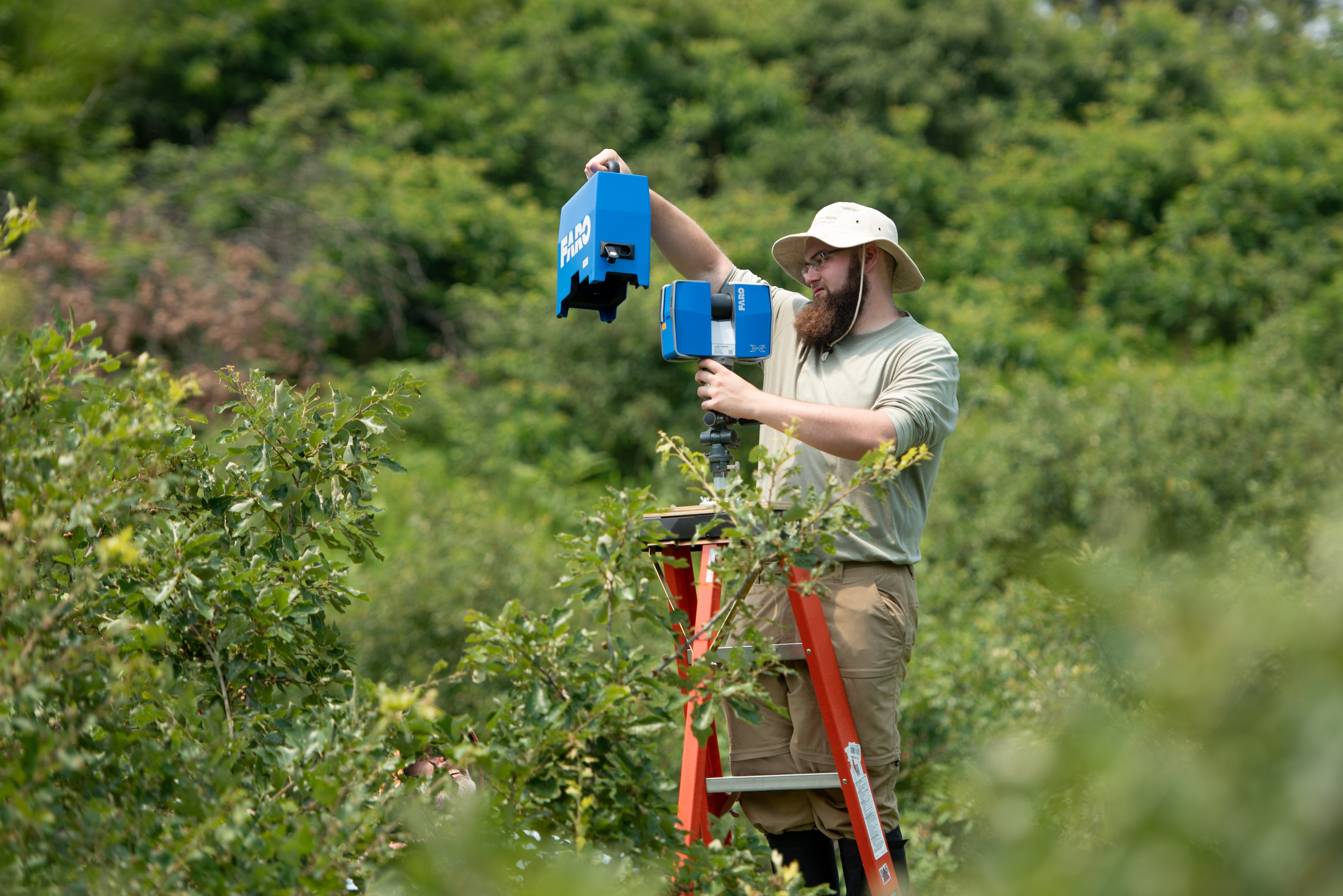  Sean Rigney ’20 uses a terrestrial laser scanner to collect 3D images of the shrub structure in the Albany Pine Bush Preserve. Working with Steve Rice, professor of biology, Rigney is among more than 130 students across a multitude of disciplines engaged in a summer research project.