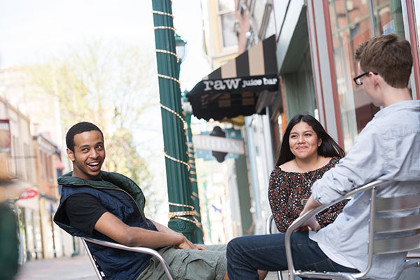 Herbert Schmertz at a presidential campaign event for Robert F. Kennedy, speaking at rear, in 1968.