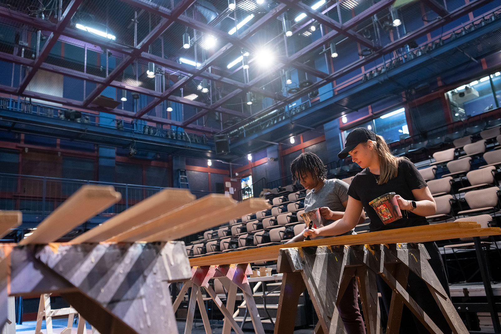 Students in Yulman Theater painting sets and props.