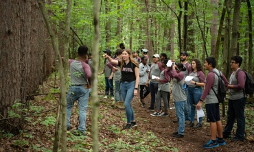 Maeve Daby ’23 leads students in Union’s summer Science and Technology Entry Program (STEP) on a nature walk through the H.G. Reist Sanctuary, a 111-acre preserve that borders the Kelly Adirondack Center.