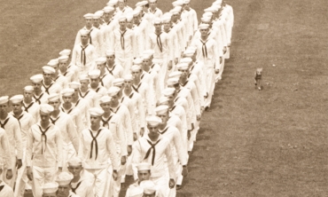Throckmorton, described as the most widely known of Union's many campus dogs, runs with the Navy’s V-12 College Training Program on Rugby Field in the 1940s.