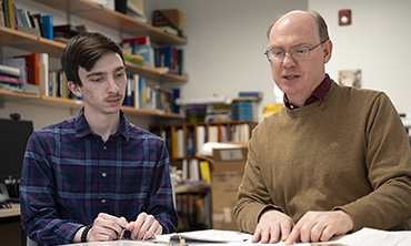 A student and astronomy professor consider some documents